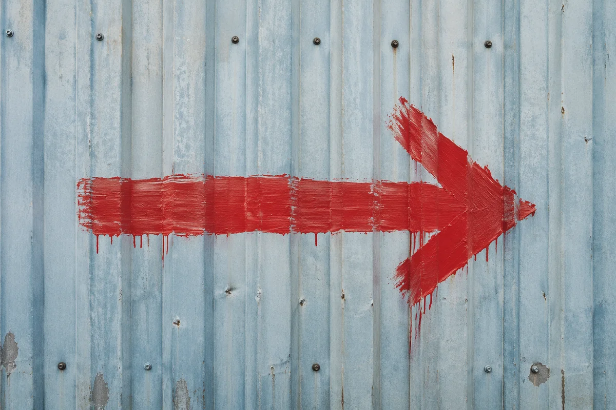 Red Arrow on Blue Gray Metal