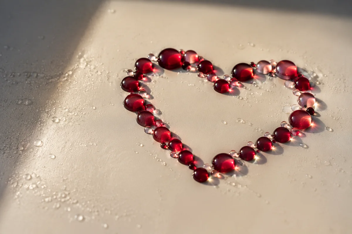 Translucent Red Glass Heart on Cream