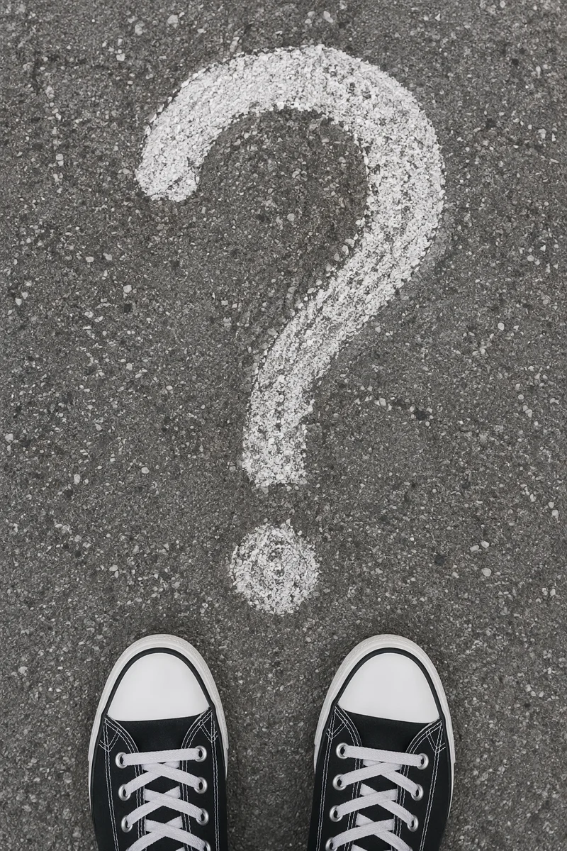 Large Question Mark on Gray Asphalt