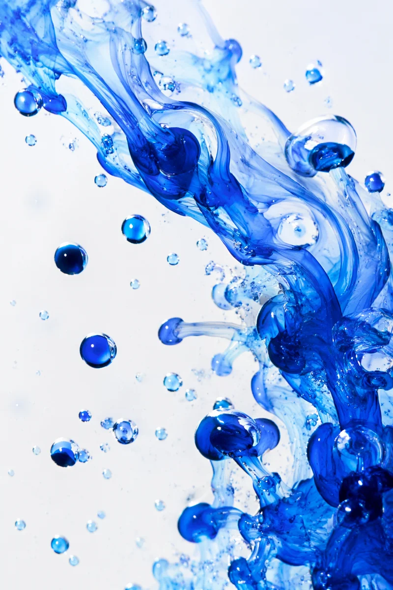 Cobalt Ink Swirls in Clear Water