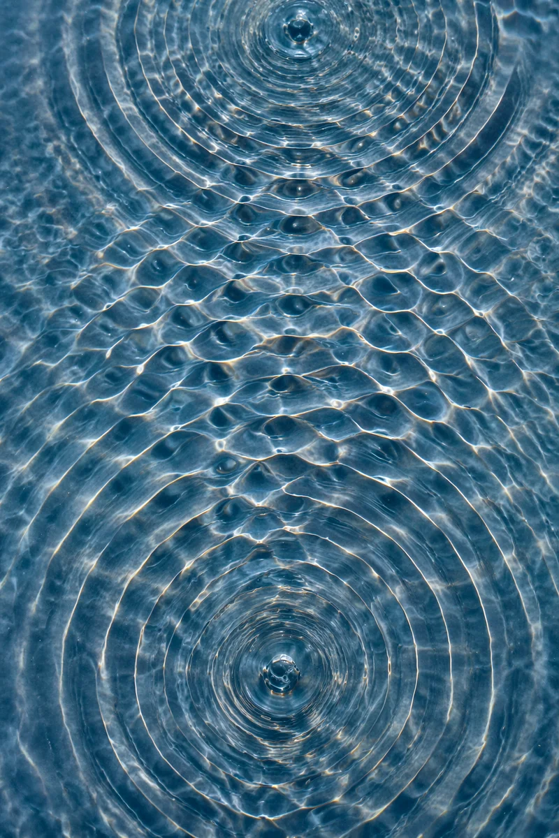 Abstract Water Ripple Interference Pattern Background