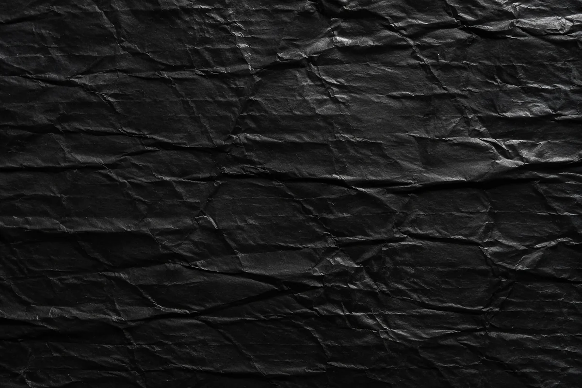 Matte Black Crumpled Texture Background