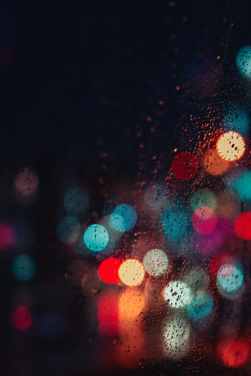 Colorful Rainy Night Bokeh Light Background