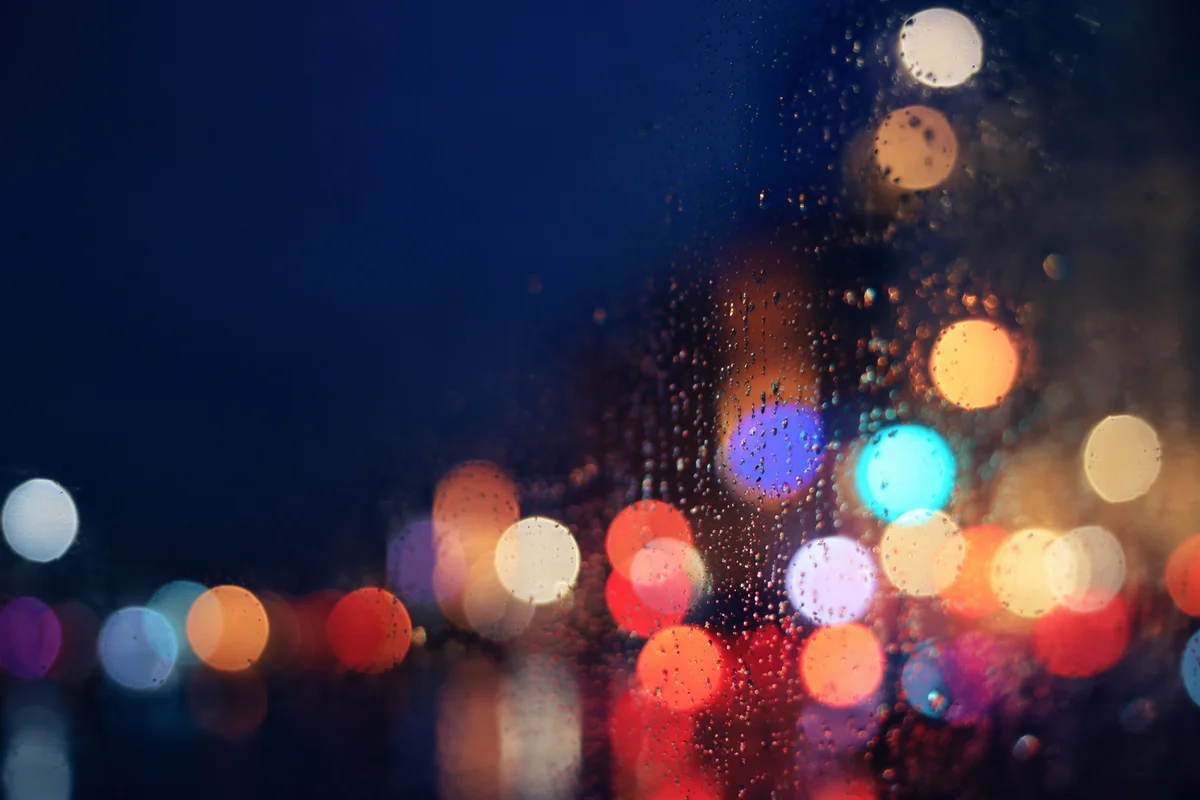 Colorful Rainy Bokeh Lights at Dusk