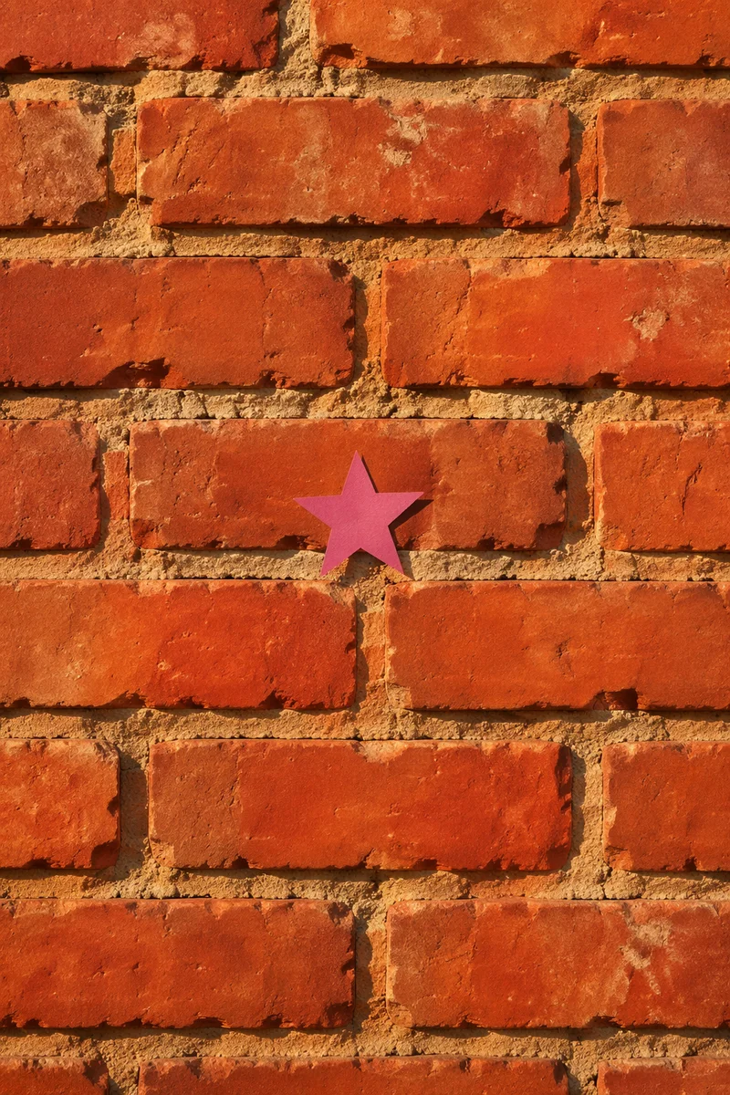 Aged Red Brick Wall With Magenta Star