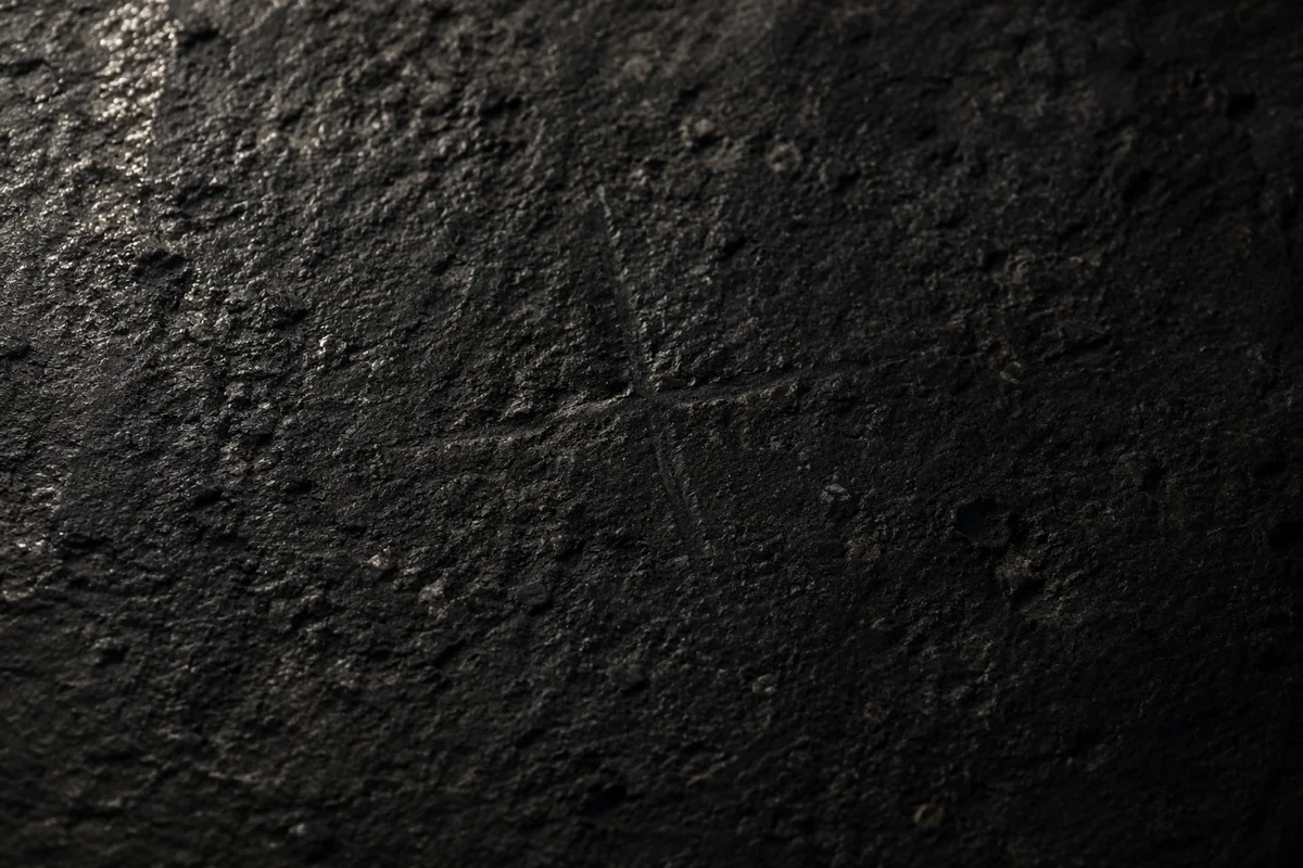 Dark Stone Texture With Subtle Cross
