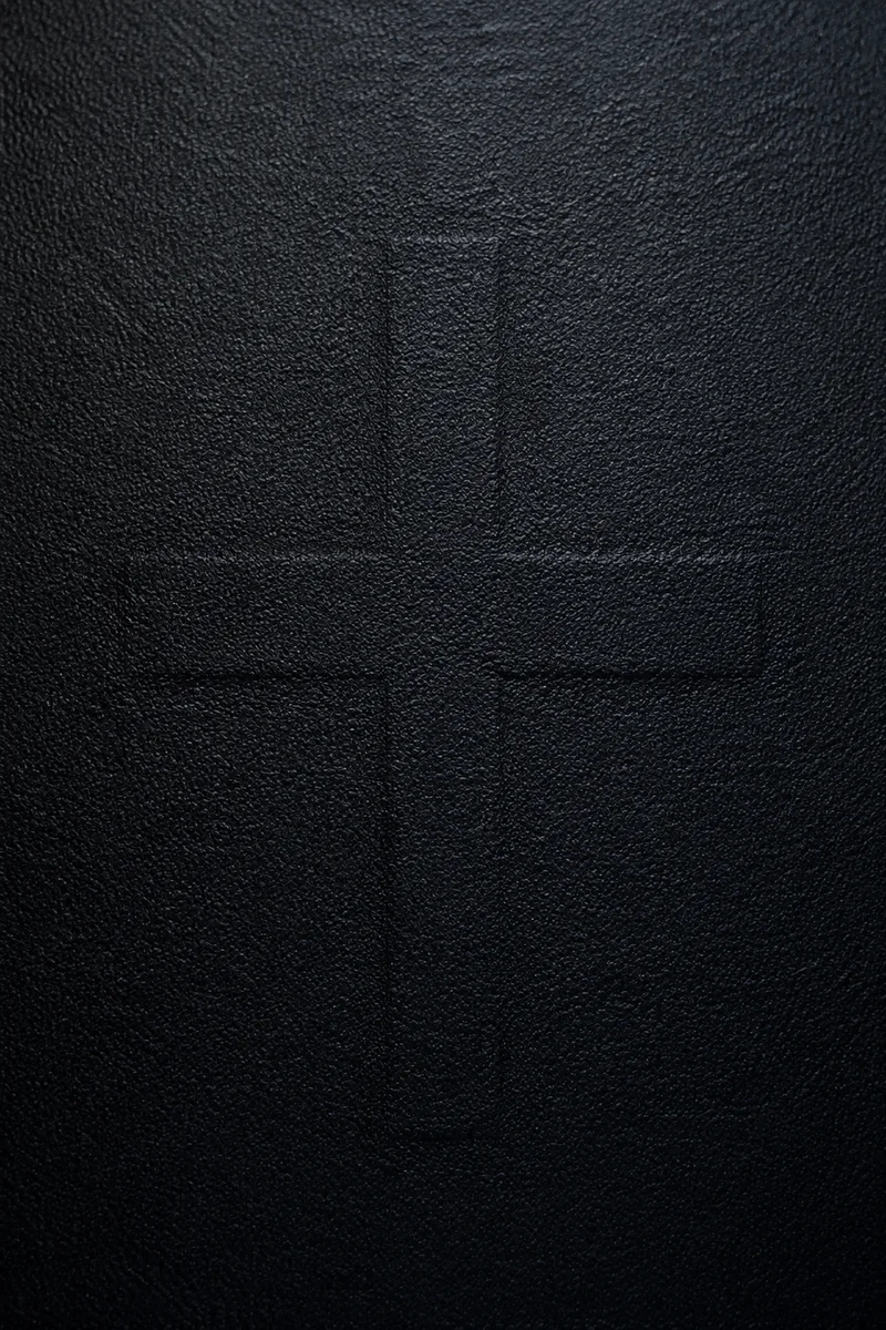 Subtle Cross on Dark Textured Background