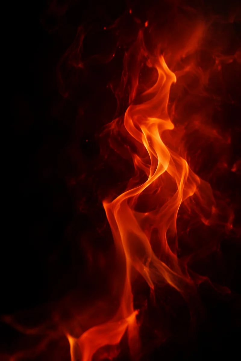 Dramatic Twisting Flame on Dark Background