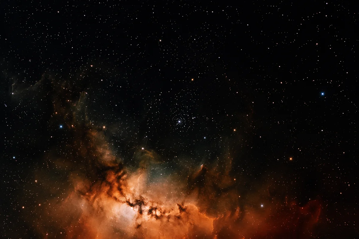Orange Nebula in Dark Star Field