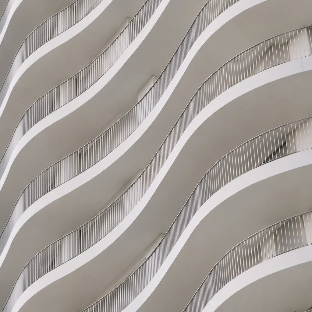 Minimalist White Facade With Geometric Waves