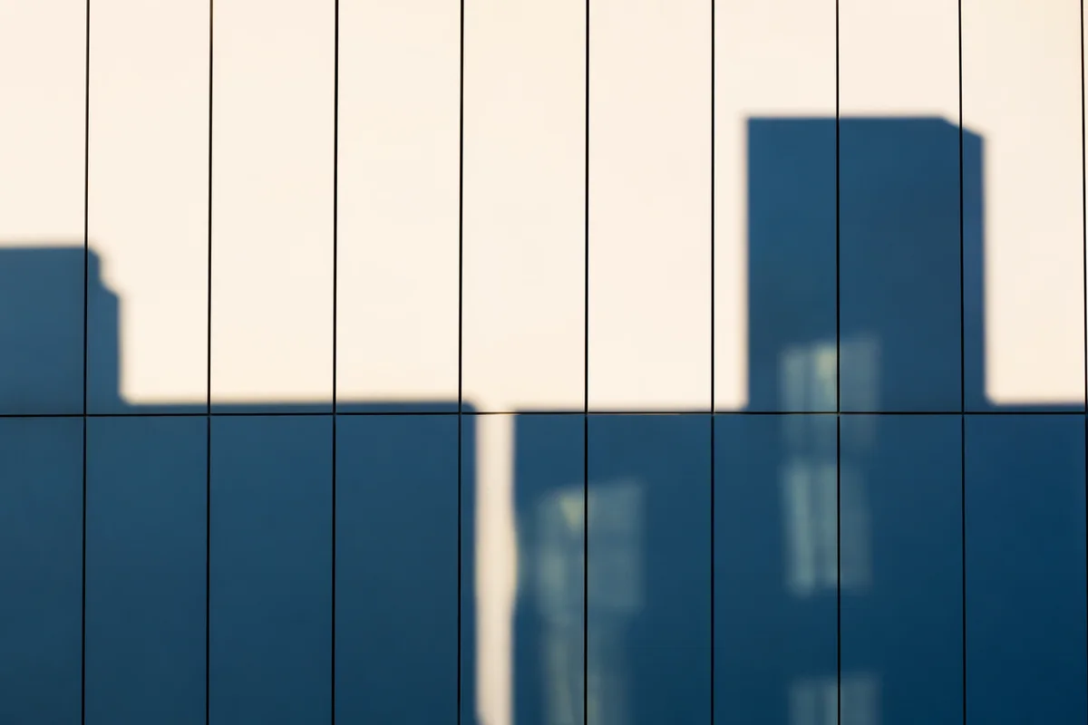 Minimalist Geometric Facade with Blue Shadows