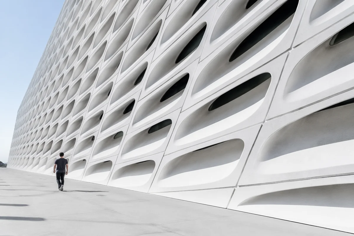 Minimalist Geometric Facade with Futuristic Walkway