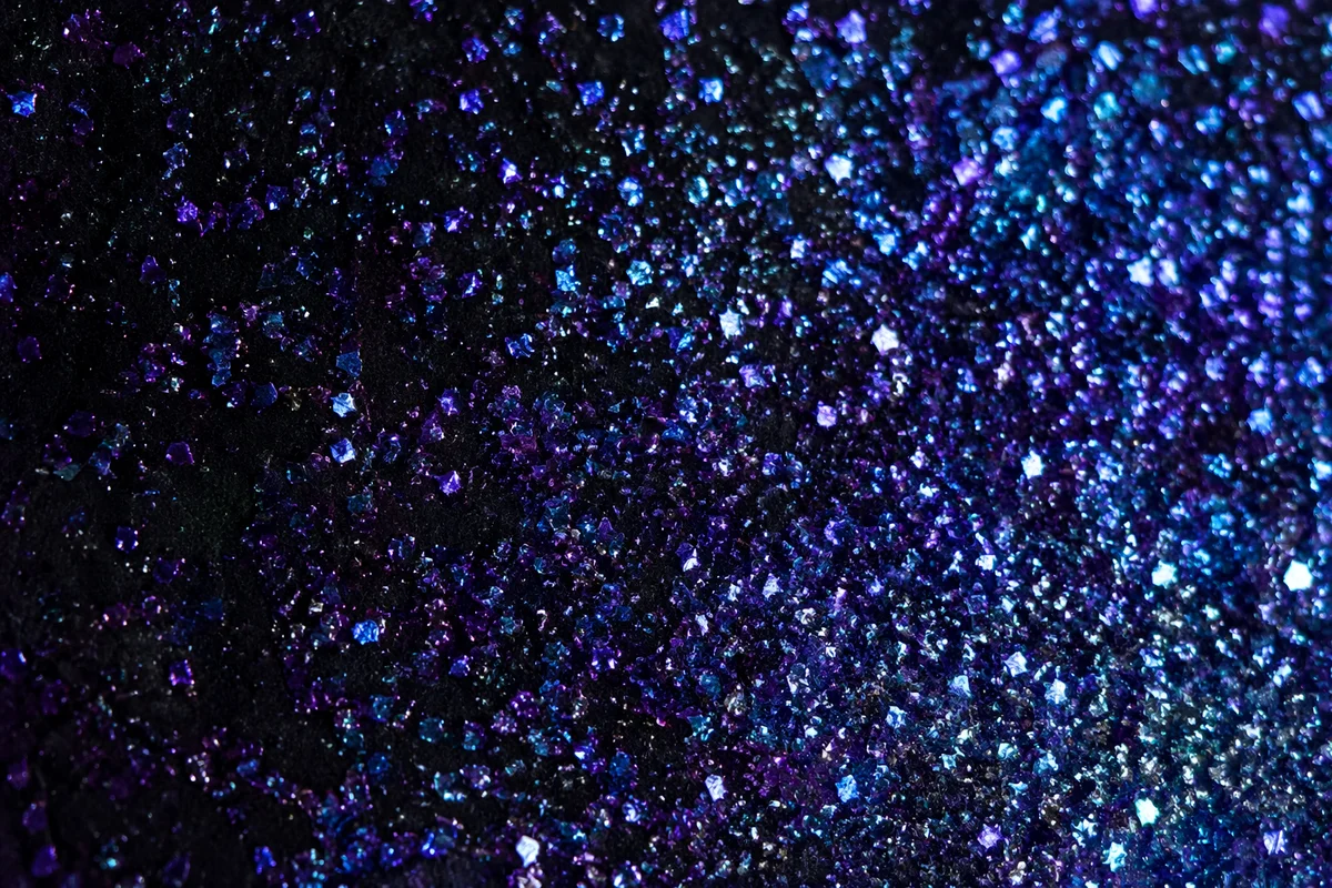 Festive Violet Glitter on Black Background