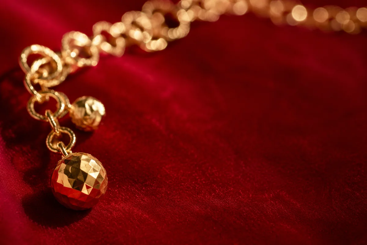 Elegant Gold Chain on Crimson Velvet