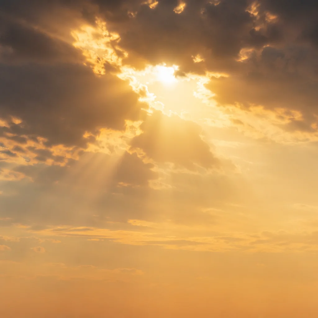 Golden Heavenly Light Rays Through Clouds
