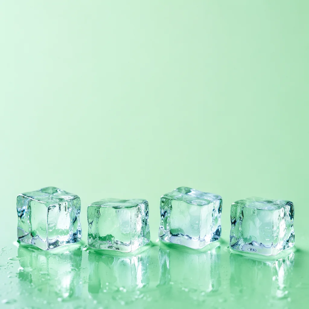 Melting Ice Cubes on Fresh Green Background
