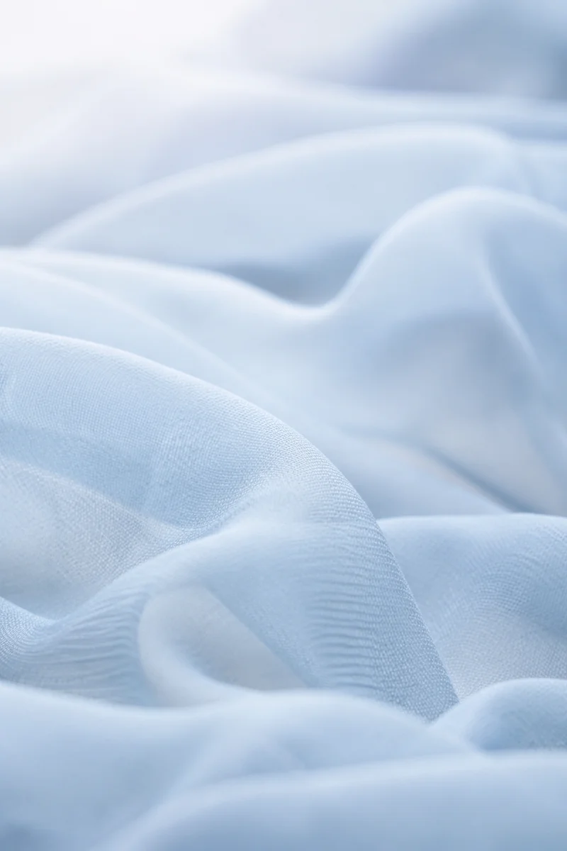 Soft Light Blue Draped Fabric Background