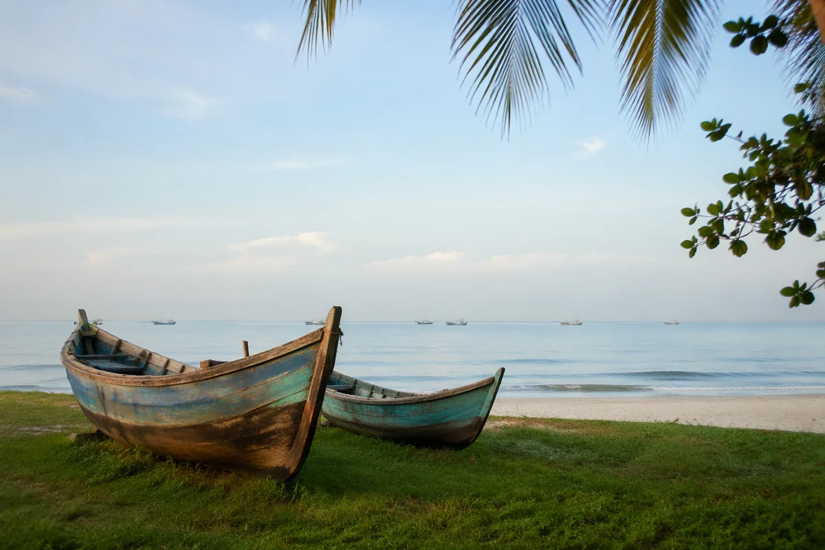 Calming Coastal Boats on Light Blue Shore