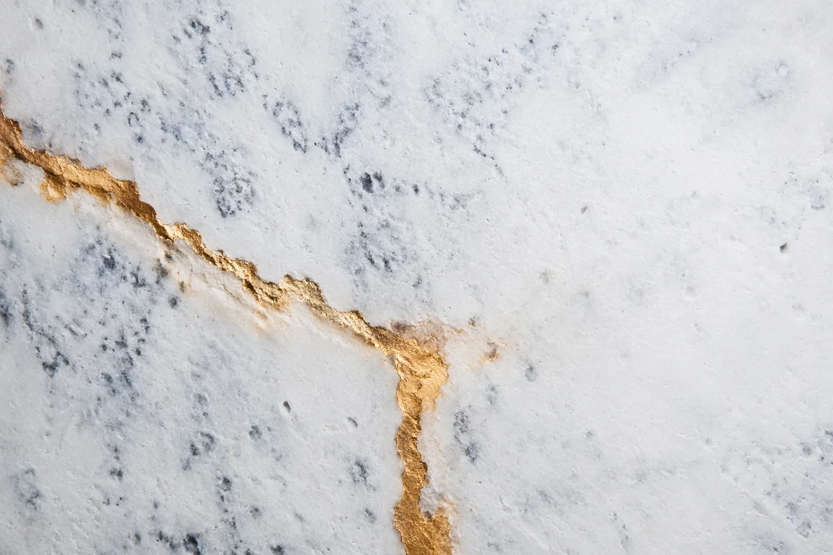 White Marble Background with Gold Cross Accent