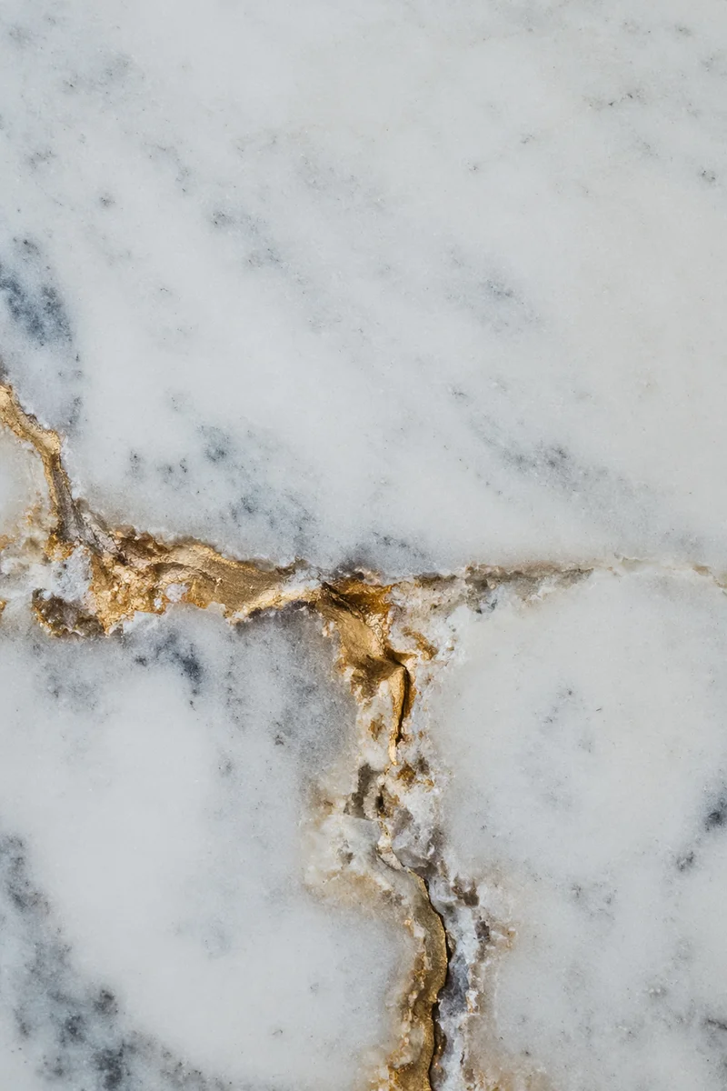 White Marble Background with Gold Cross Accent
