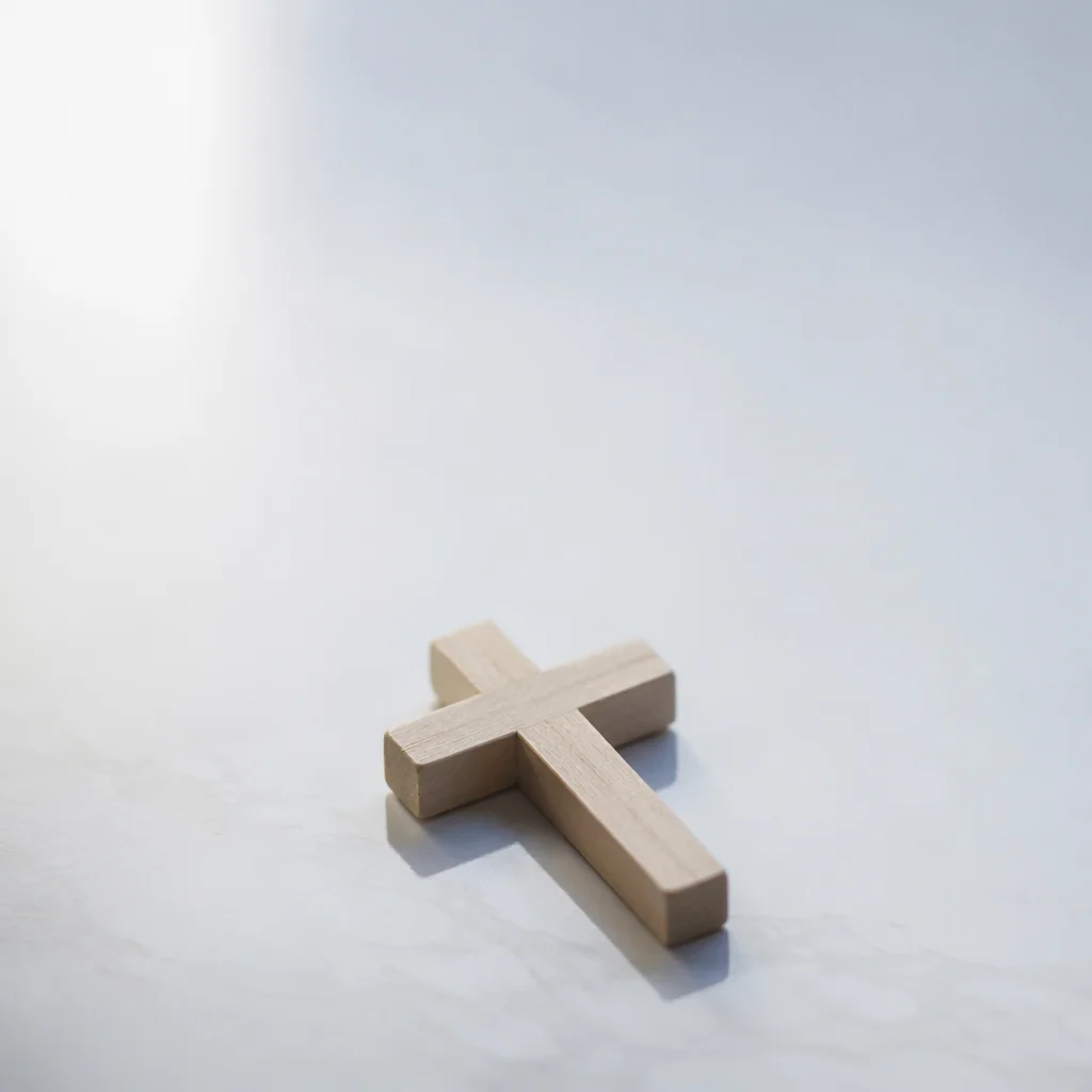 Minimal Wooden Cross on Glossy Blue Background