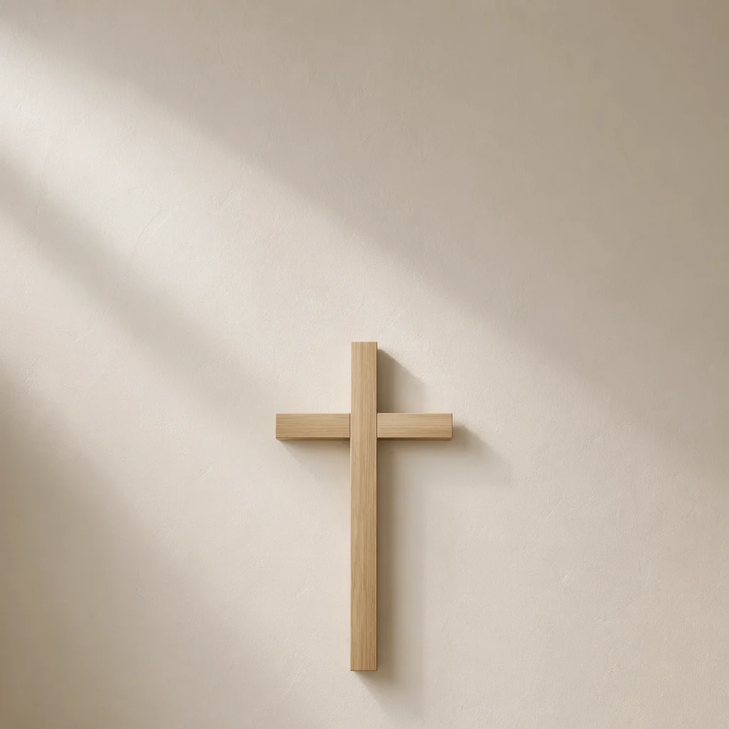 Minimalist Wooden Cross on Plaster Wall