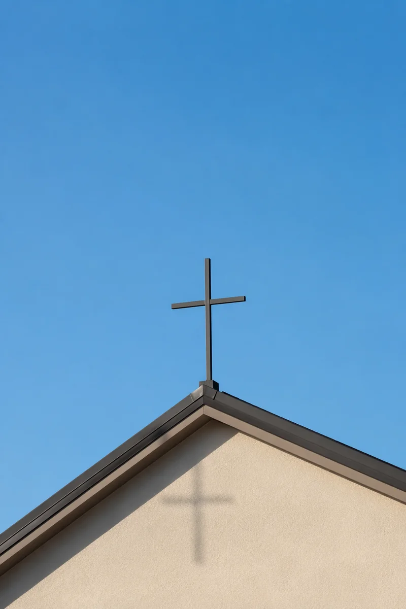 Minimal Cross Above Beige Chapel Roof