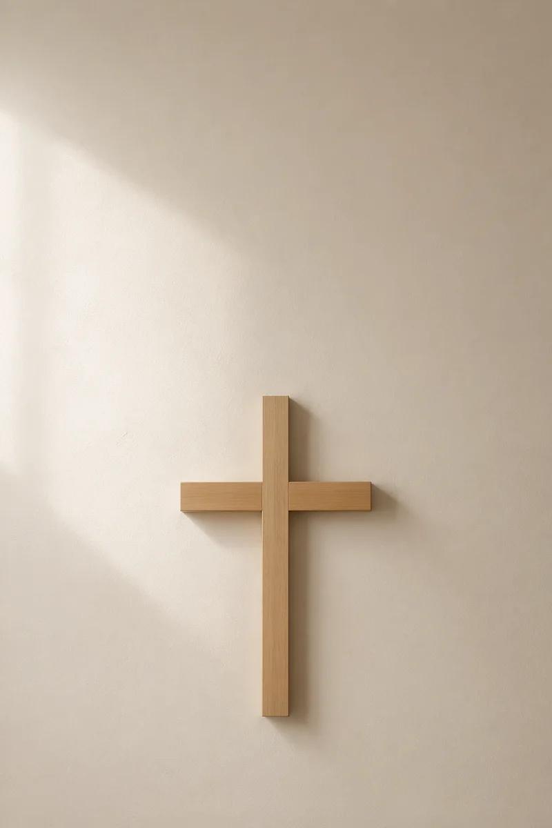 Minimalist Wooden Cross on Plaster Wall