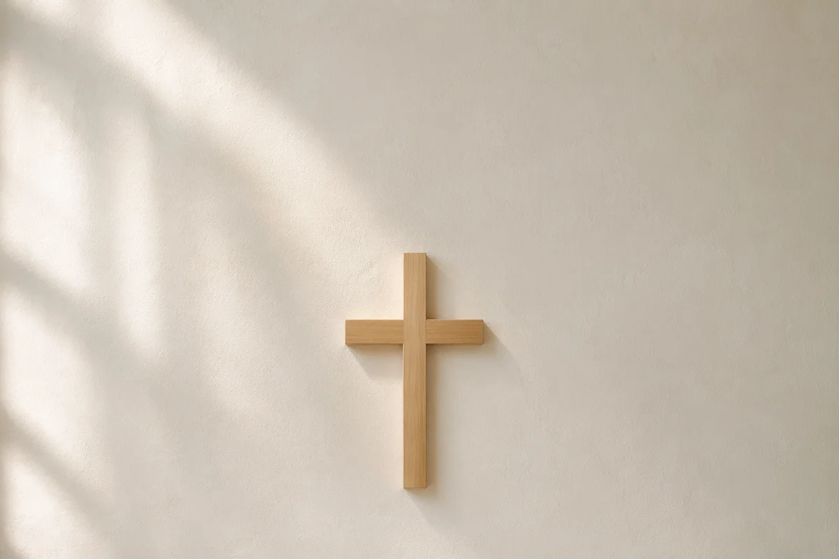 Minimalist Wooden Cross on Plaster Wall