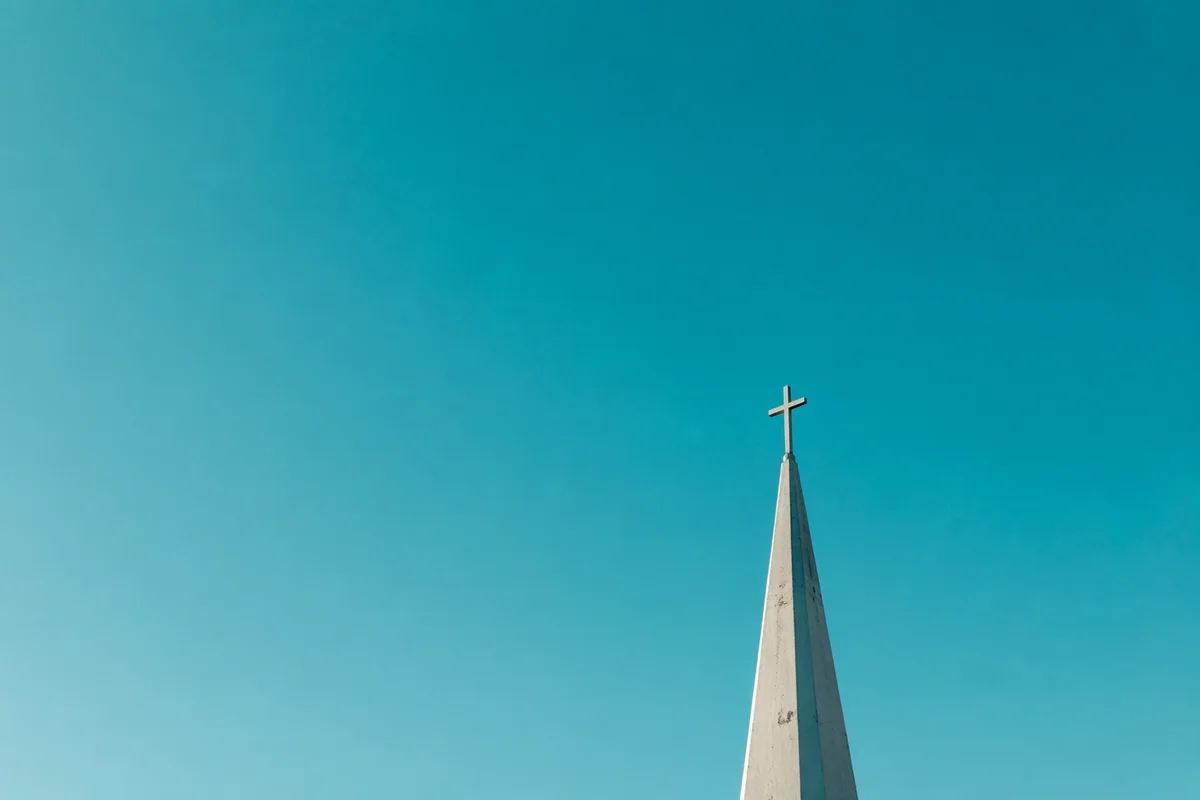 Minimalist Church Cross Against Turquoise Sky
