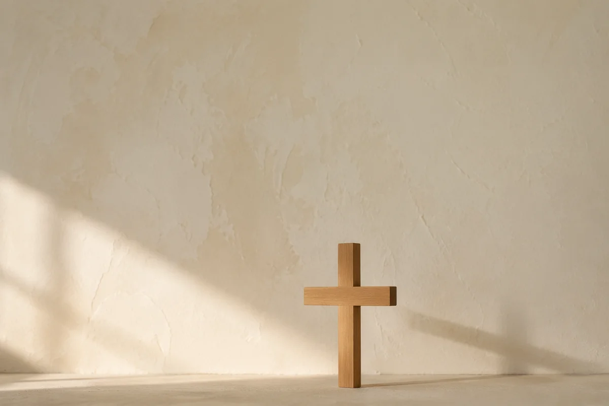Minimal Wooden Cross on Pale Wall