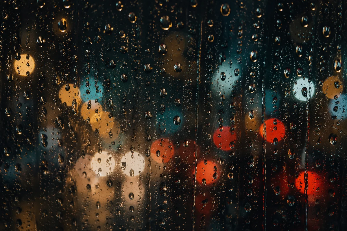 Rain Droplets on Blurred City Window