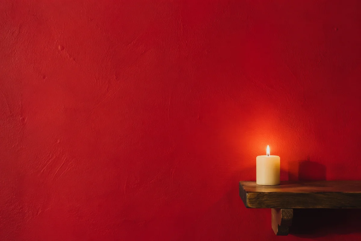 Vibrant Red Prayer Corner with Candle