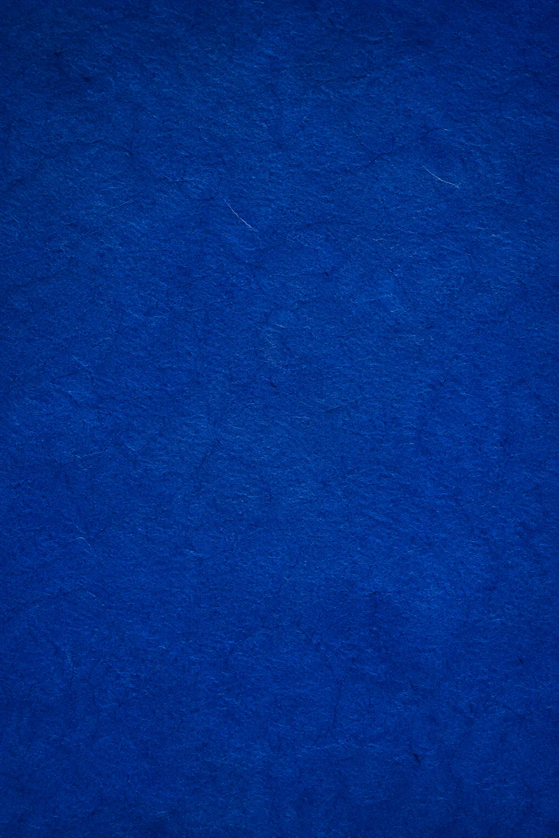 Deep Royal Blue Textured Paper Background