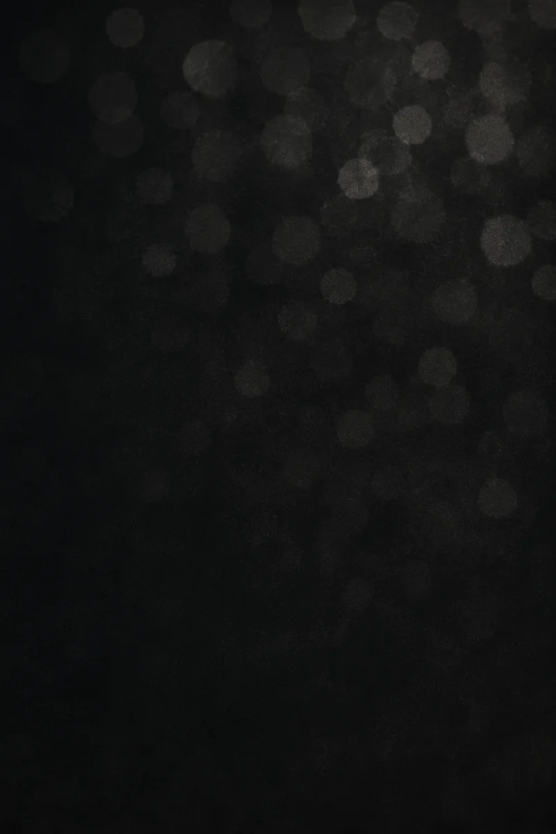 Soft Silver Bokeh on Dark Background