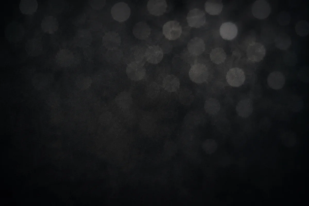 Soft Silver Bokeh on Dark Background