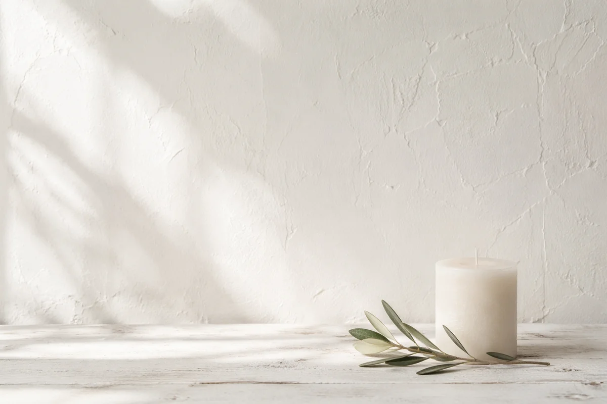 Minimal White Candle and Olive Branch Background