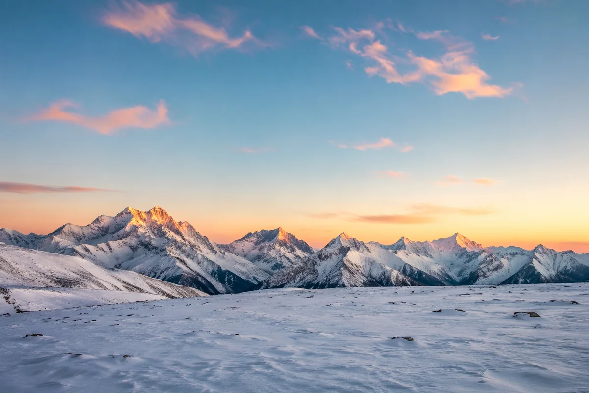 Panoramic Alpine Sunrise Over Snowy Peaks