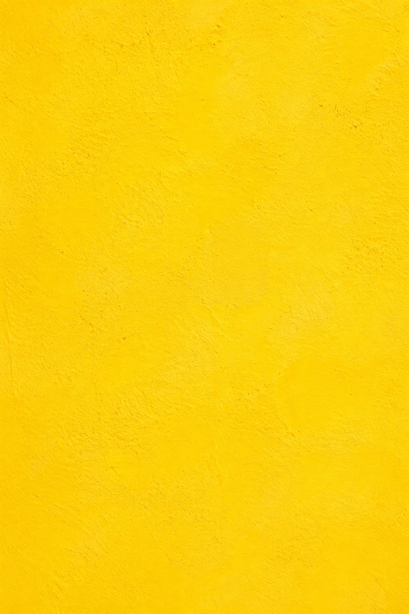 Bright Cheerful Yellow Stucco Background