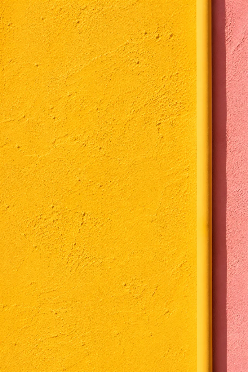Bright Sunflower Yellow Stucco Background