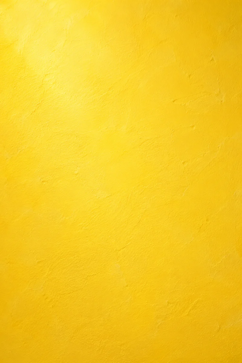 Bright Yellow Textured Studio Background