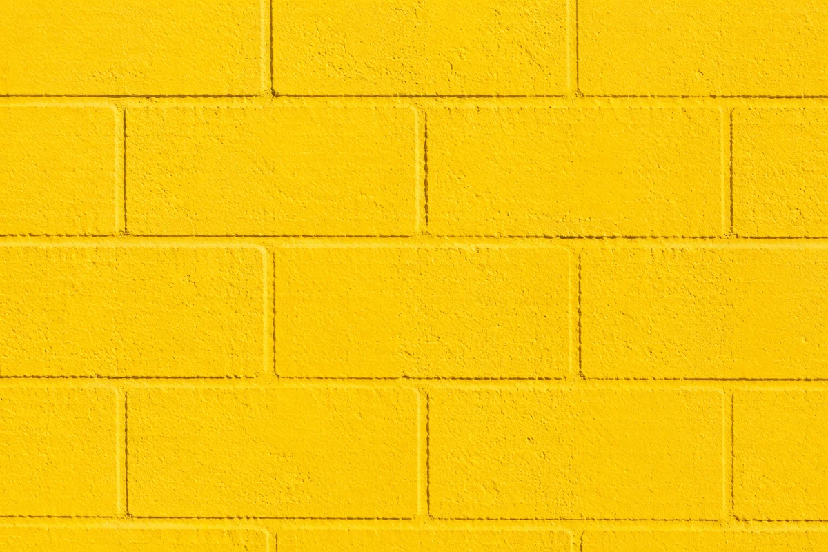 Bright Cheerful Yellow Concrete Wall Background