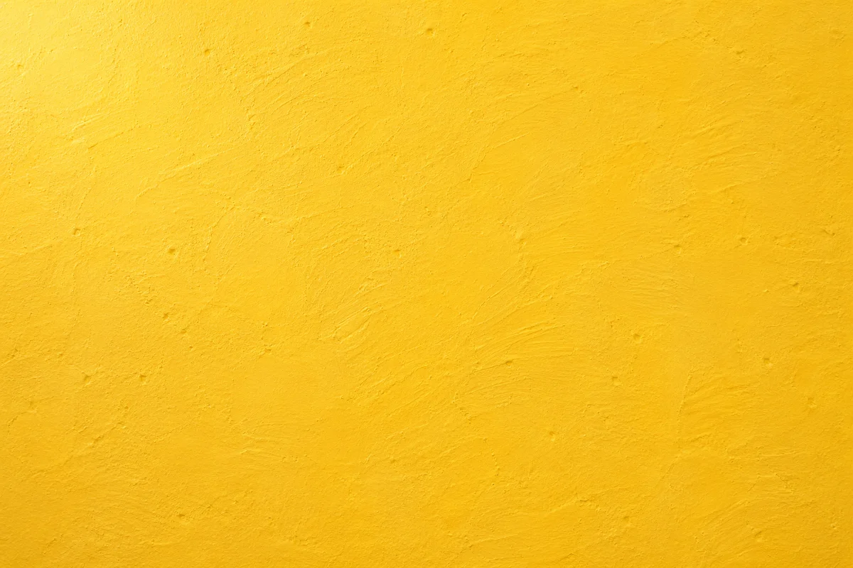 Bright Yellow Textured Wall Background