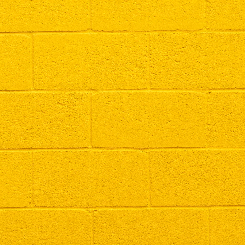 Bright Yellow Painted Concrete Wall Background
