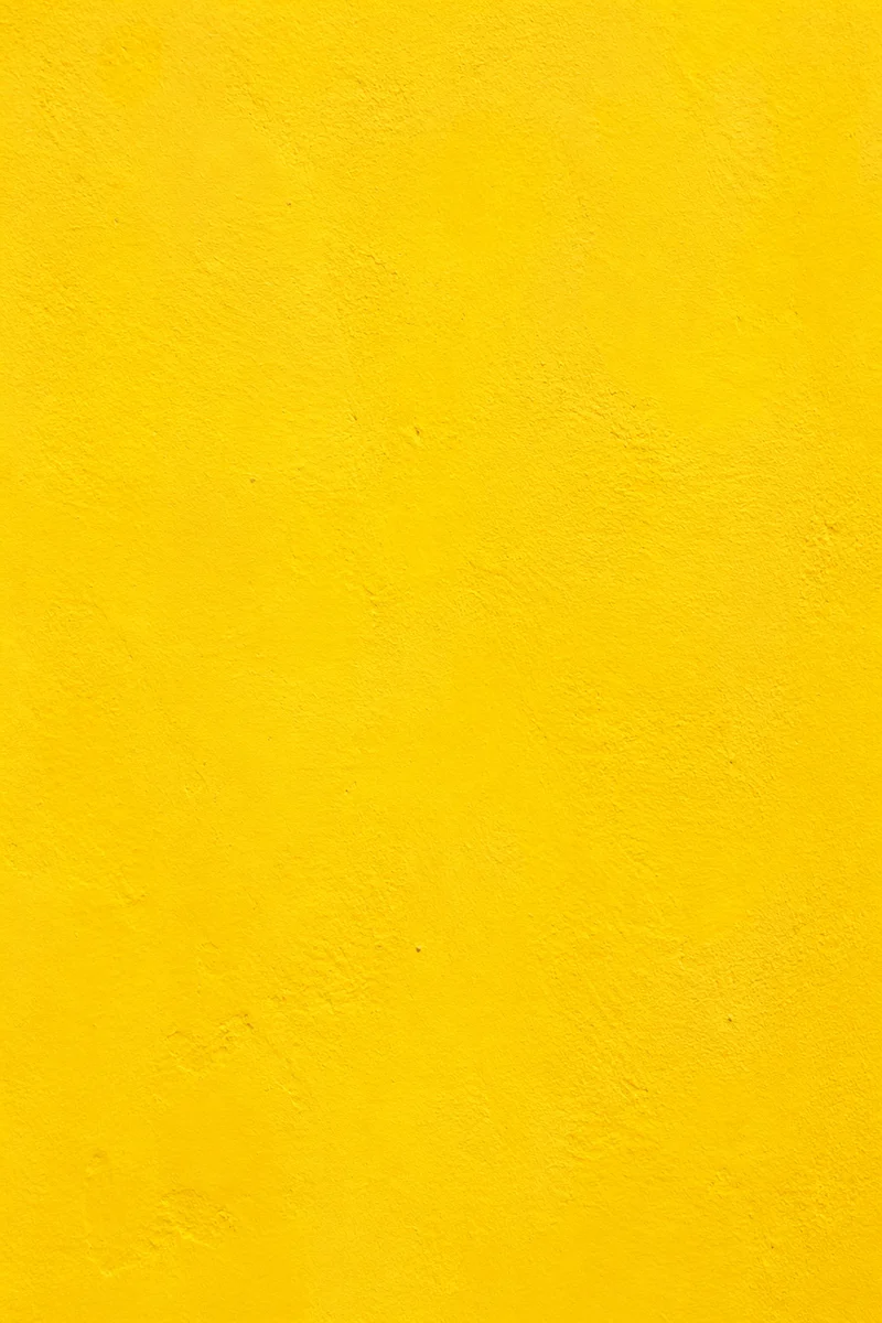 Bright Cheerful Yellow Stucco Background