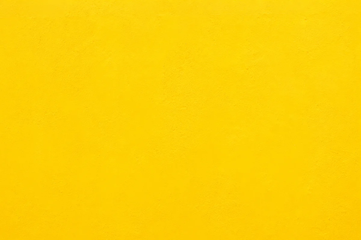 Bright Cheerful Yellow Plaster Background