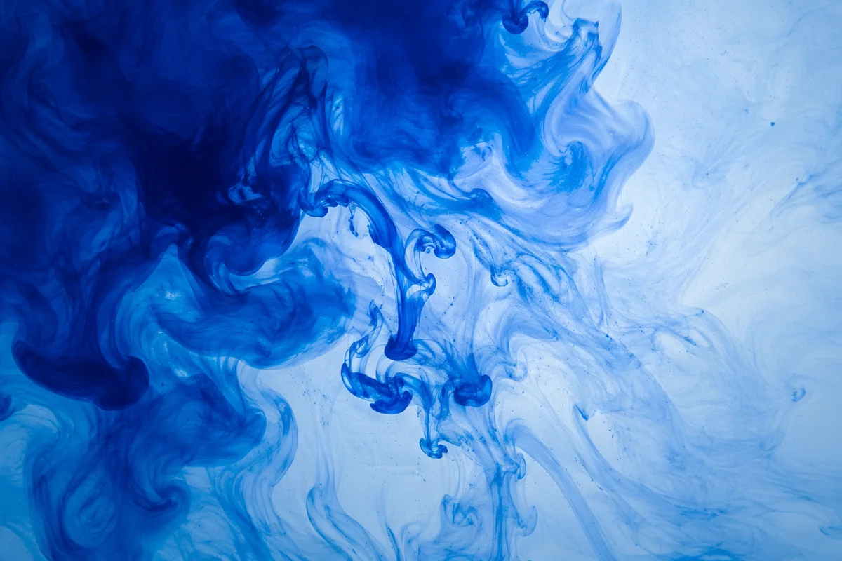 Blue Ink Swirls in Luminous Water