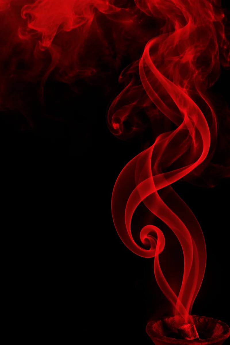 Crimson Smoke Wisps on Black Background