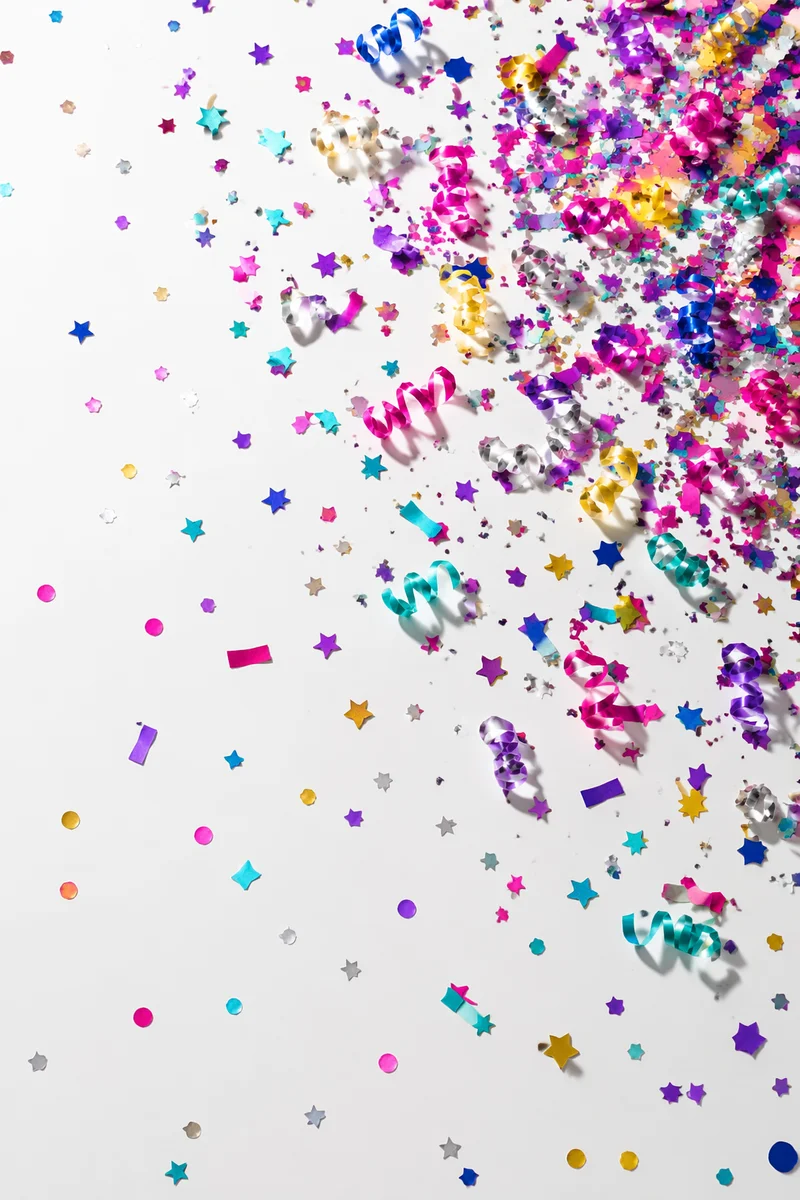 Colorful Confetti Celebration on White Background