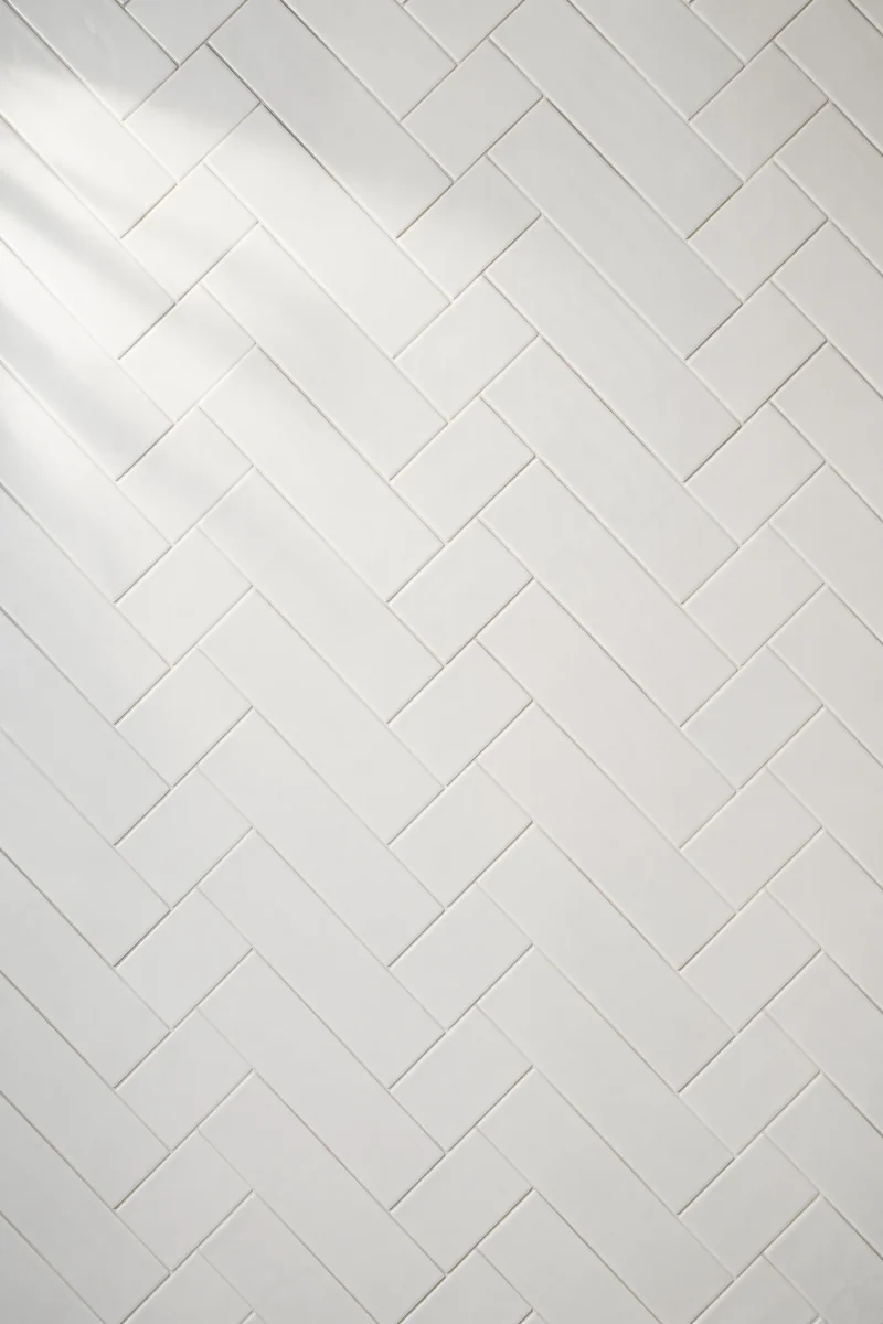 Clean White Herringbone Tile Background